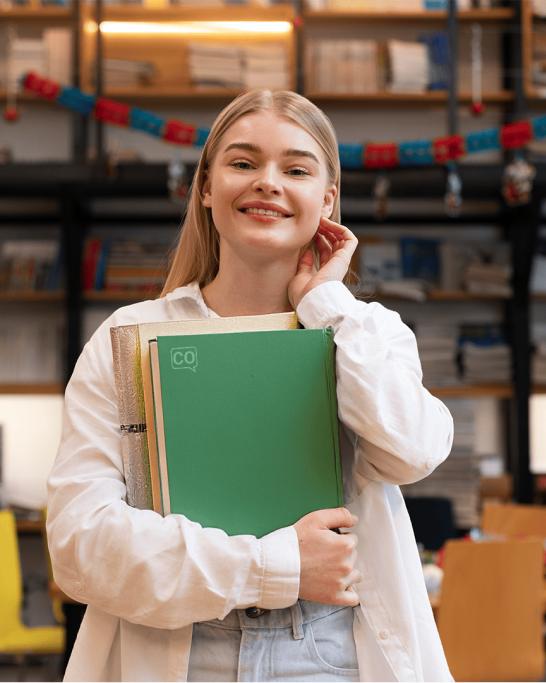 Teacher looking at the camera with coLanguage learning materials